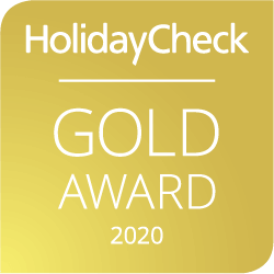 Ein Gold-Auszeichnungssymbol von HolidayCheck für das Jahr 2020.